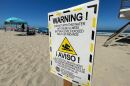A sign warning of high bacteria levels in the ocean water is seen at Imperial Beach, Calif. July 4, 2022.
