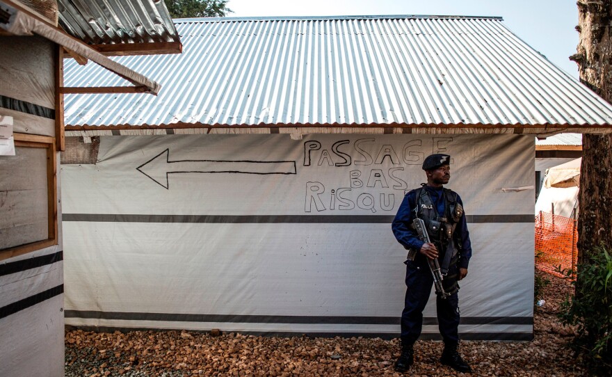 A police officer stands guard inside an Ebola treatment center in Butembo. Rebels attacked the facility on March 9, killing one officer and injuring another.