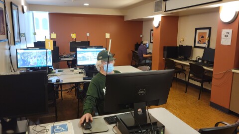 Seniors use computers at the Gary & Mary West Senior Wellness Center in downtown San Diego on July 13, 2021.