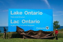 Ontario Premier Doug Ford, right, and Niagara West Member of Provincial Parliament Sam Oosterhoff unveil a sign for Lake Ontario at the Fifty Point Conservation Area in Grimsby, Ontario, Canada, on Saturday, Aug. 29, 2026. (Keito Newman/The Canadian Press via AP)