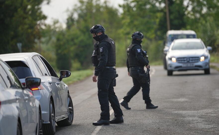 Police guard a road leading to RAF Fairford, in Fairford, England, Monday, Sept. 28, 2026.
