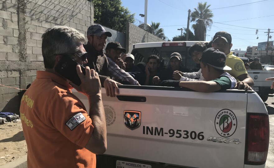 A National Migration Institute officer takes migrants to different shelters across Tijuana, Nov. 15, 2018.