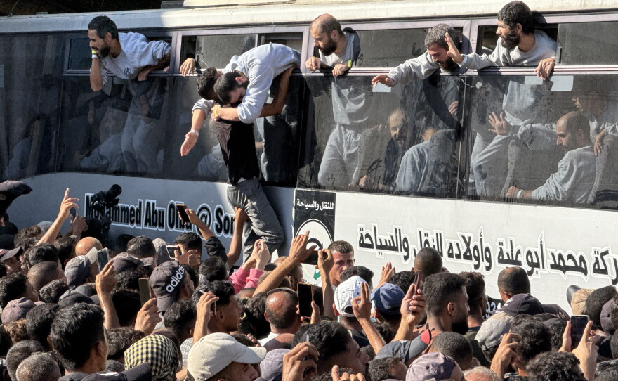 In Khan Younis, families greet Palestinian prisoners who were freed in exchange for Israeli hostages on Oct. 13, 2025.