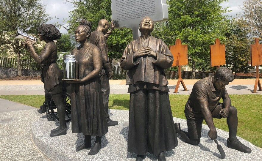 Artist Branly Cadet's <em>Arise</em> sculpture at the National Memorial for Peace and Justice in Montgomery, Ala.,<em> </em>portrays community activists.