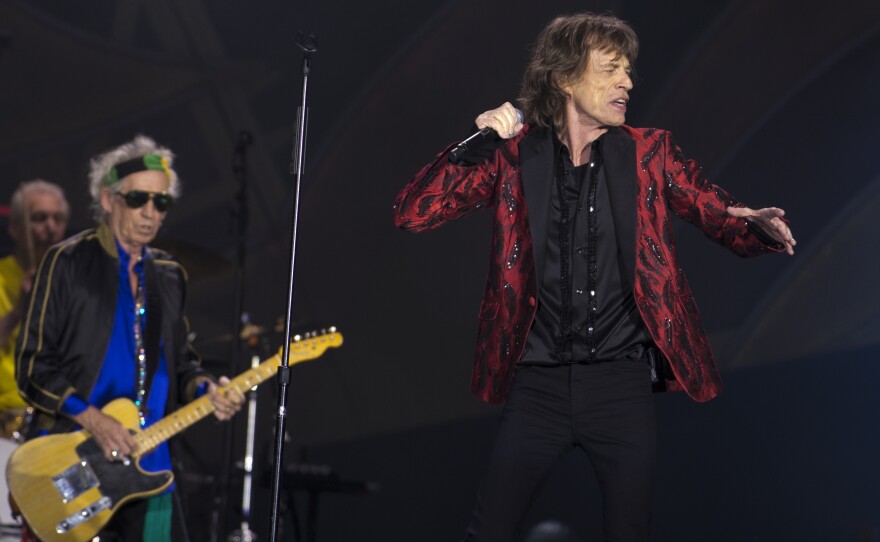 Singer Mick Jagger , foreground, guitarist Keith Richards and drummer Charlie Watts, of British band, the Rolling Stones, perform at Real Madrid’s Santiago Bernabeu soccer stadium, in Madrid, Spain, June 25, 2014. 