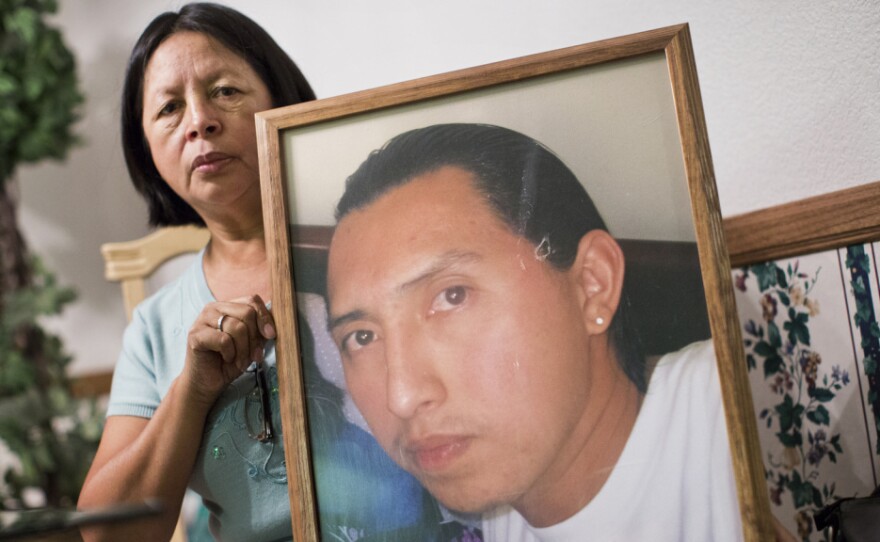 Carmen Cobian holds a photograph of her son, 26-year-old Christian Cobian, who was shot and killed by Los Angeles County Sheriff's deputies in January 2012. Cobian is among the 375 people shot by on-duty police officers between 2010 and 2014 in Los Angeles County.