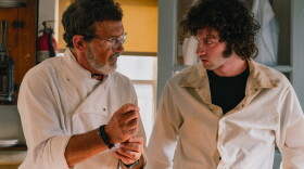 A restaurant's head chef portrayed by Antonio Banderas (left) takes under his wing a 19-year-old Anthony Bourdain, played by Dominic Sessa (right), in Tony.