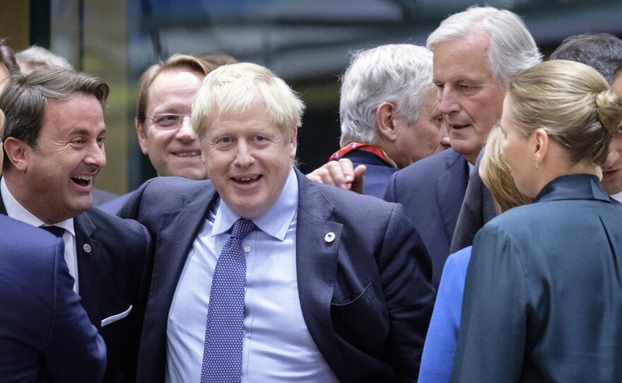 Luxembourg's Prime Minister Xavier Bettel (from left), U.K. Prime Minister Boris Johnson and the European Commission's chief Brexit negotiator, Michel Barnier, at the start of an EU summit on Thursday in Brussels. EU and British negotiators came to an agreement on the United Kingdom's departure from the EU known as Brexit.