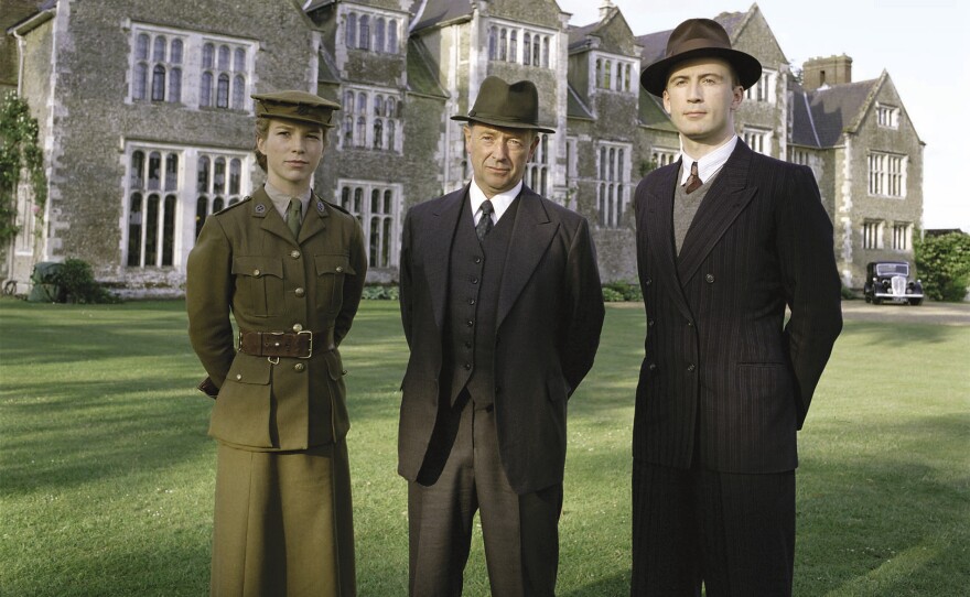 Detective Superintendent Christopher Foyle (center), driver Samantha "Sam" Stewart (left), and Detective Sergeant Paul Milner in a scene from episode 203 "War Games," FOYLE'S WAR Season 2
