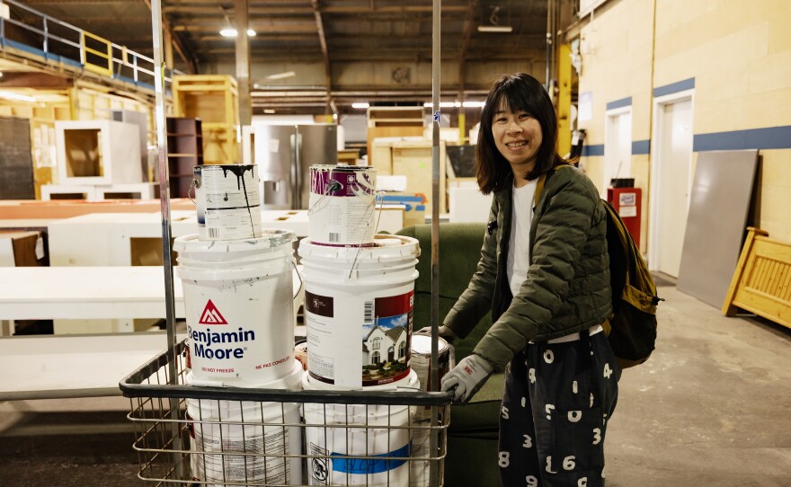 Film student Oyster Liao shops for paint at EcoSet, which will be used in an upcoming film project.