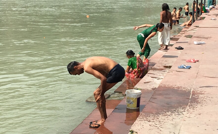 A man bathes on the banks of the Ganges River in the town of Rishikesh near the headwaters. Up and down the 1,500-mile course of the iconic river, Indians worship, wash, and cremate their dead — a practice that environmentalists say pollutes the river and should be curtailed.