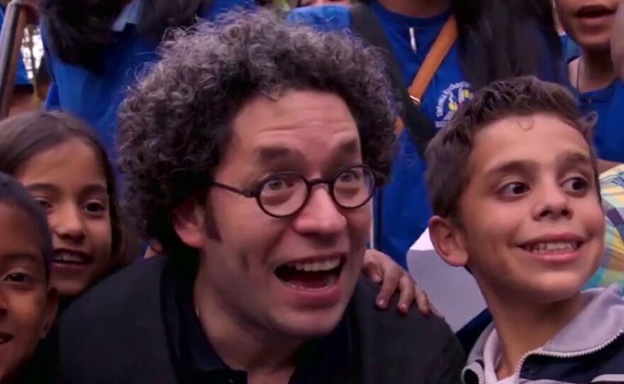 Venezuelan conductor Gustavo Dudamel with young fans in the documentary "¡Viva Maestro!"