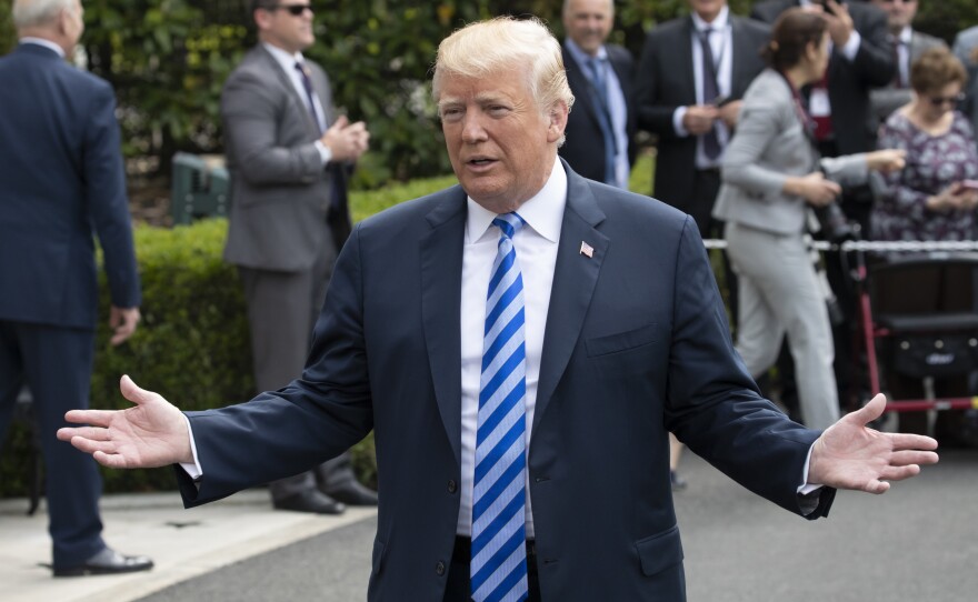 President Trump addresses reporters as he leaves for Dallas to speak at the National Rifle Association convention on Friday.