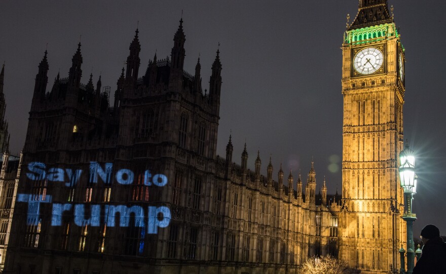 A message of "Say no to Trump" is projected on Britain's Houses of Parliament the evening before a Monday parliamentary debate took place on Donald Trump's state visit. Nearly 2 million people signed a petition in support of scrapping or downgrading the invitation.