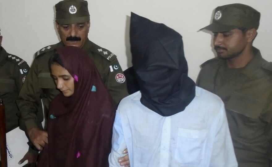 Aasia Bibi and her boyfriend, Shahid Lashari, are presented to journalists at a police station in Muzaffargarh, Pakistan, on Monday.