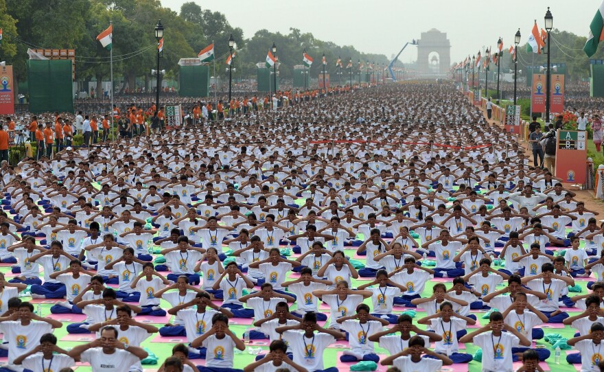 A mass yoga session on Rajpath, New Delhi's ceremonial boulevard, marks International Yoga Day.