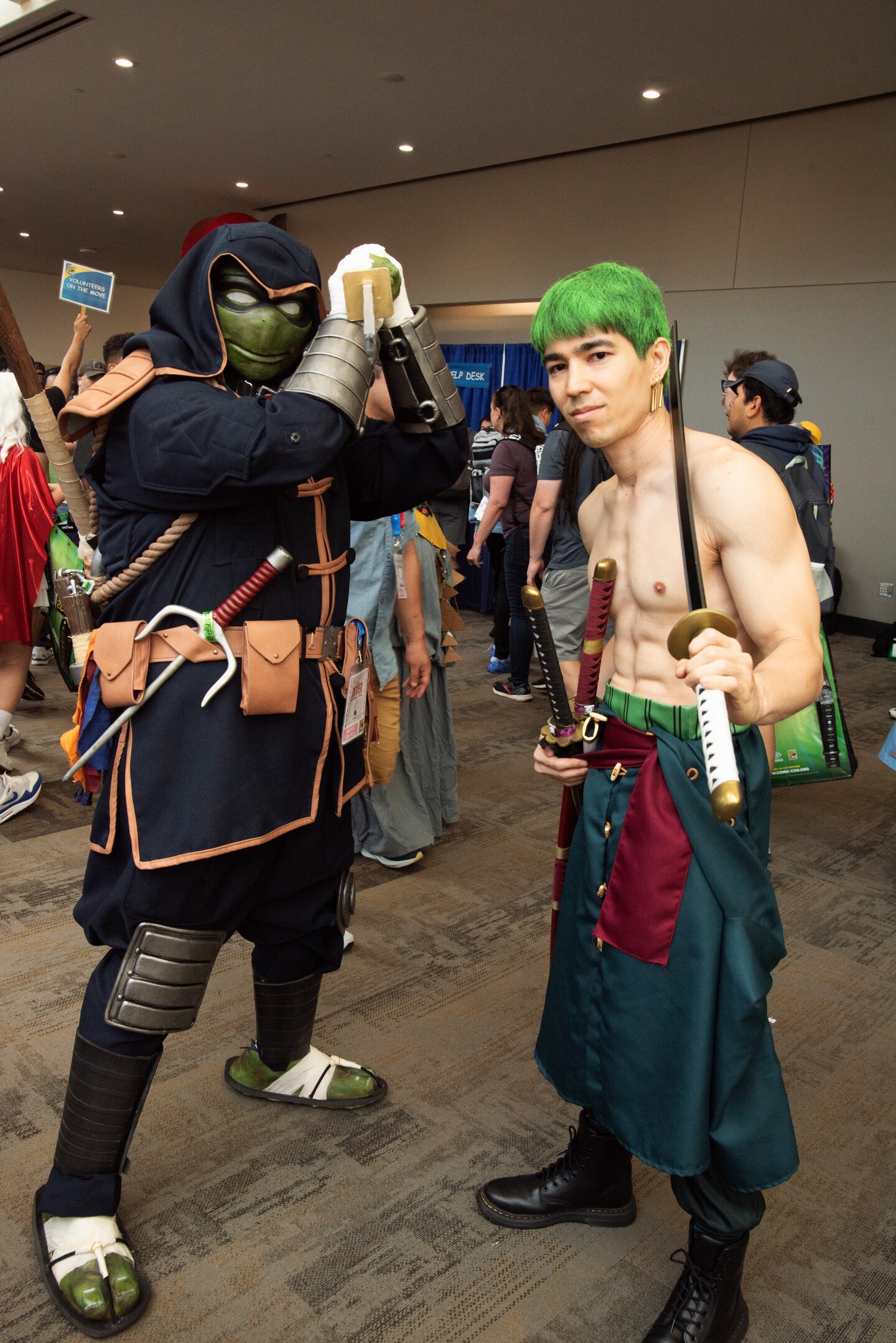 Michael Orlando (left) and Dallas M. Bellamy (right) cosplay as the Last Ronin from the "Teenage Mutant Ninja Turtles" and Zoro from "One Piece" on July 25, 2025.