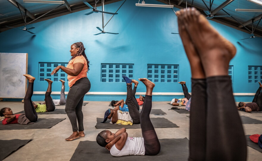 Yoga classes (shown above) and calisthenics are part of the training to prepare women for construction jobs.