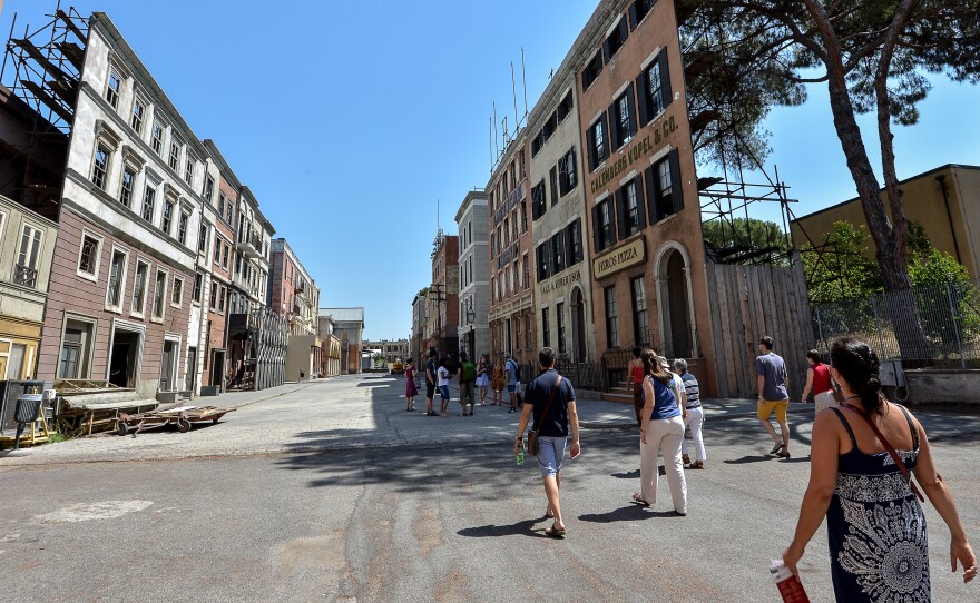 Visitors look at a set at the famed Cinecittà films studio near Rome in 2012. The 100-acre, 22-stage facility is one of Europe's largest studios. It flourished in the 1950s and '60s but fell on hard times beginning in the 1980s. Now, it's undergoing a revival.