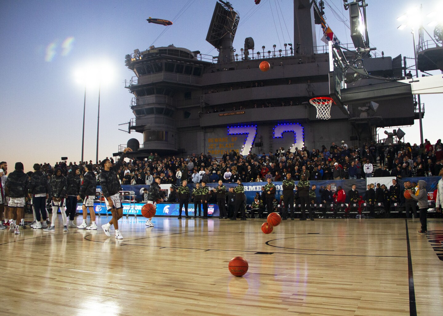 Gonzaga warms up after halftime as fans watch on board the USS Abraham Lincoln during the Armed Forces Classic in San Diego on Nov. 11, 2022.