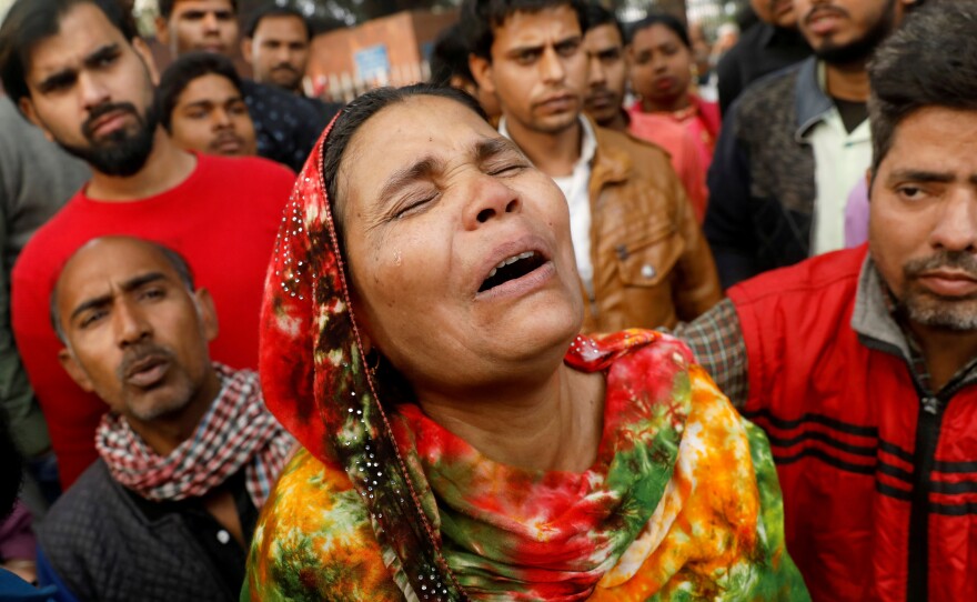 A fire that swept through a factory where laborers were sleeping on Sunday morning, killing at least 43 people. Relatives of the victims gathered outside a hospital mortuary in the city on Sunday.