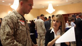 Terry Coulson speaks to Josh Lasure about available careers during the Hiring our Heroes job fair held at the Pacific Views Event Center at Camp Pendleton. 