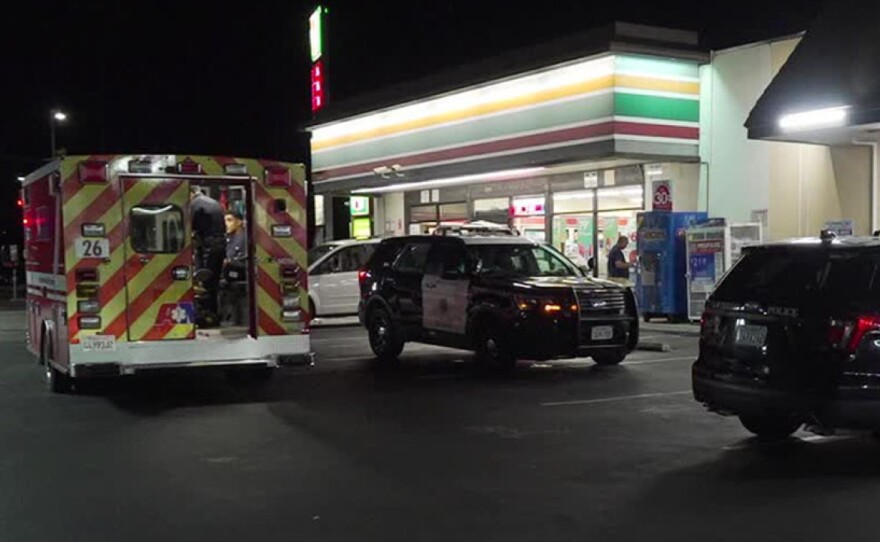 Police and emergency personnel at the scene of a cell phone robbery at a 7-Eleven store in Rolando Park on  Sept. 3, 2019.