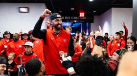 San Diego State football coach Sean Lewis celebrates with the team after becoming bowl eligible for the first time in three years on Oct. 25, 2025 in Fresno, Calif.