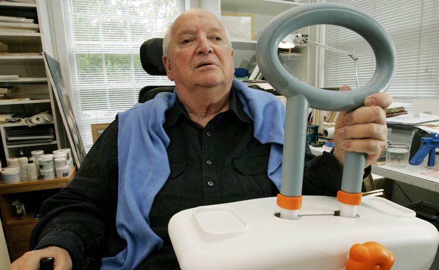 Michael Graves sits in his Princeton, N.J., studio holding a bathtub handle he designed to help the handicapped and elderly, on Sept. 11, 2009. Graves died today at age 80.