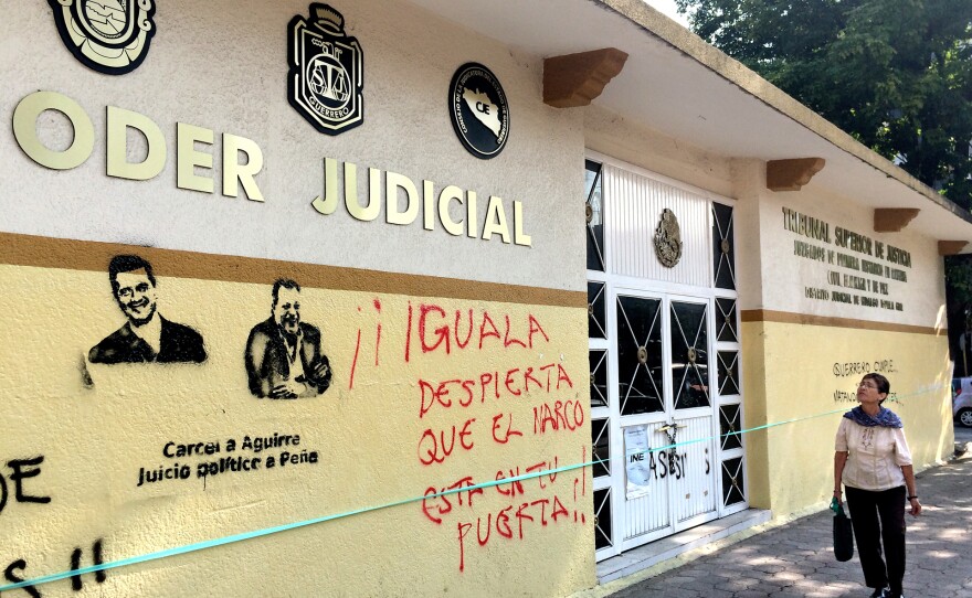 Protesters sprayed graffiti on the walls of Iguala's courthouse. Demanding that jail time for Mexico's President Enrique Pena Nieto and the now resigned Governor of the state of Guerrero, demonstrators also sprayed, Iguala Wake Up Drug Traffickers are at you Door! They were referring to the Mayor of Iguala, who authorities say gave the order to attack the students.