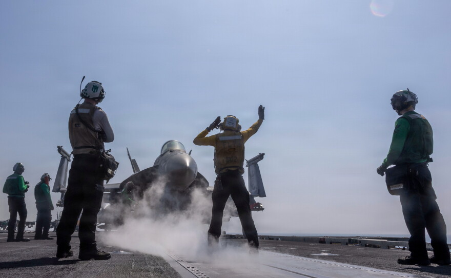 An F/A-18E Super Hornet prepares to launch from the flight deck of the aircraft carrier USS Abraham Lincoln in support of Operation Epic Fury on Feb. 28, 2026.