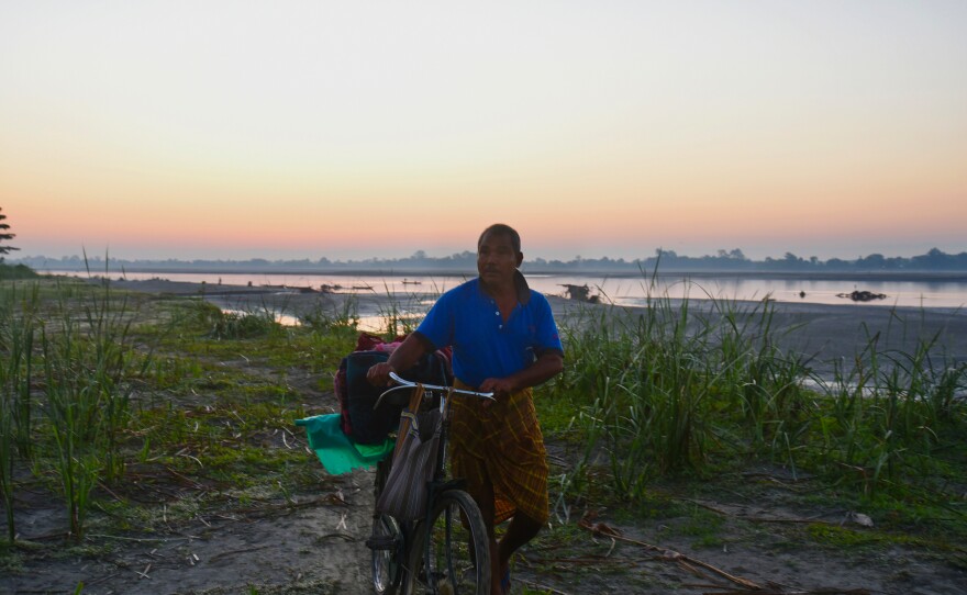 Jadav Payeng covers the distance from the island banks to his forest on his bicycle, carrying the supplies he uses while working on his forest and abundant vegetable farm.