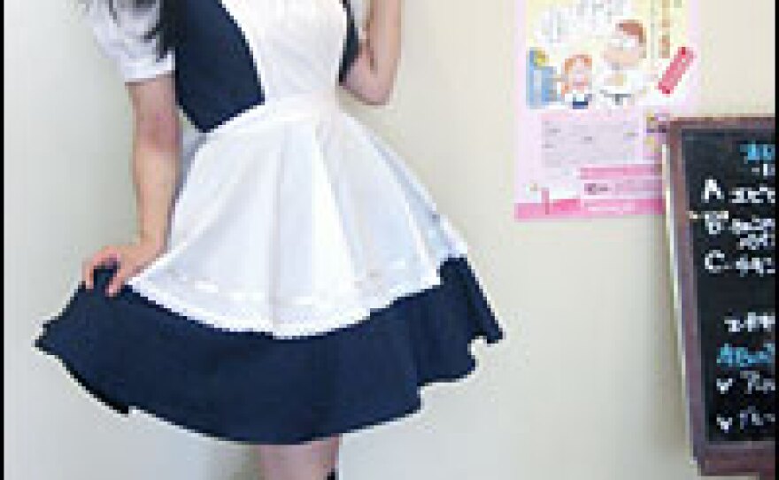 Male otaku live out their fantasies at "maid cafes," where they are waited on by maids whose costumes come from erotic comic books. Sayaka is dressed for work at the Mailish maid cafe.