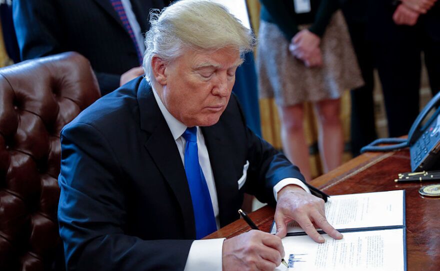 President Trump signed an executive order related to the oil pipeline industry in the Oval Office on January 24.