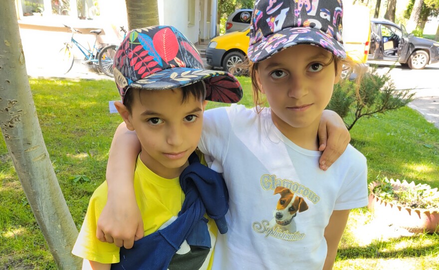 Olena (right), 11, and her little brother Zhenia, 9. They have not heard from their mother since the beginning of the war.