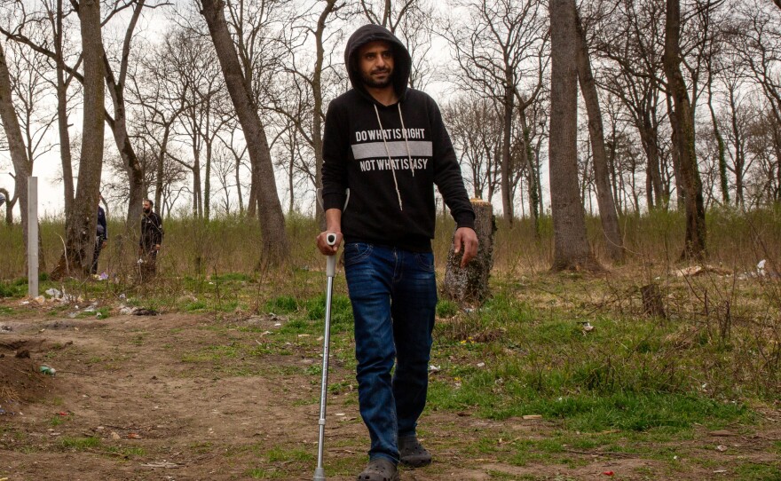 Ahmad al-Ghazali, from Syria, lives just outside the perimeter of Sombor camp in Serbia's north, near the borders with Croatia and Hungary. He was injured during a recent attempt to cross into the EU, he says, when he tried jumping the barrier that Hungary built along its boundary with Serbia and Croatia in 2015 to prevent asylum-seekers from accessing the country.