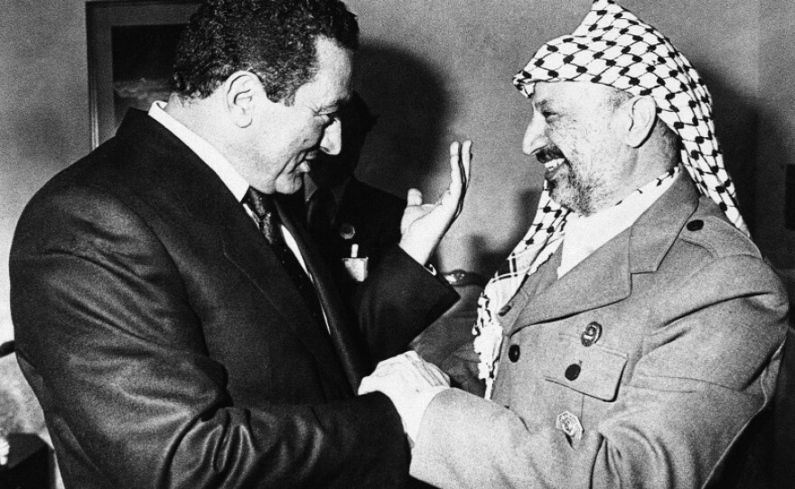 Mubarak speaks with Palestine Liberation Organization leader Yasser Arafat in Kuwait at the sidelines of the 5th Islamic Summit on Jan. 27, 1987. The Egyptian president maintained peaceful relations with Israel during difficult times.