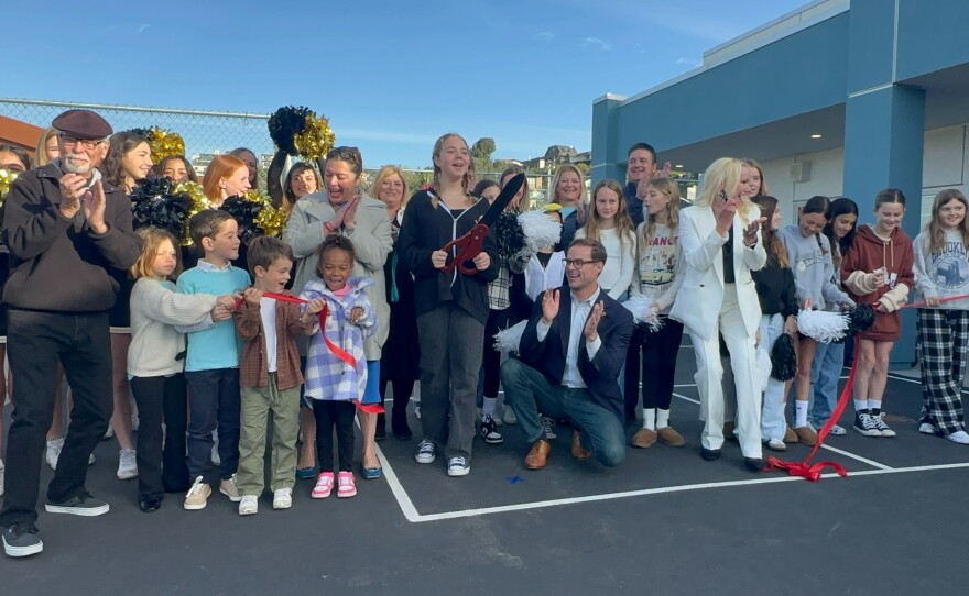 Students cut the ribbon to mark the official completion of a modernization project at Pacific Beach Elementary School on Feb. 2, 2025.