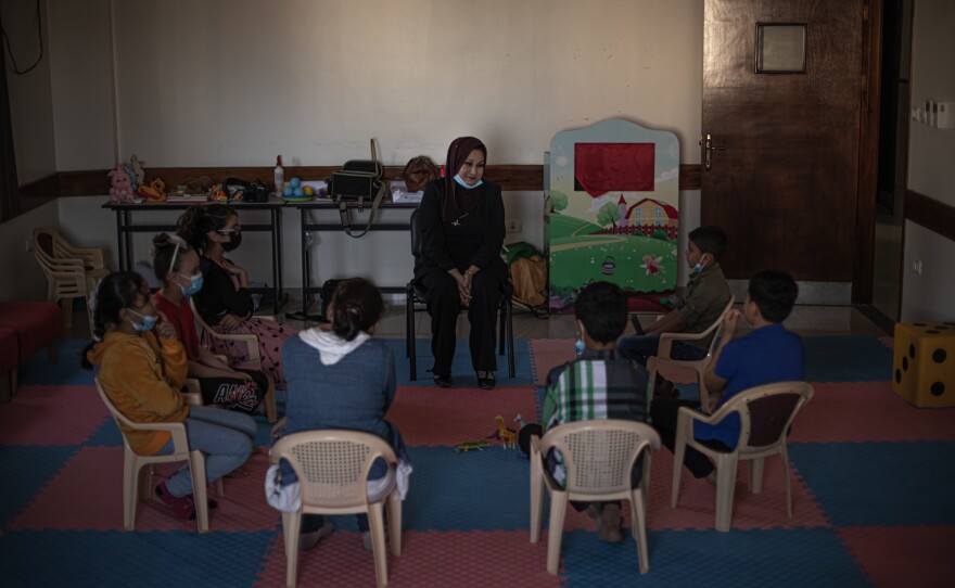 Psychologist Aida Kassab leads children through a psychodrama session aimed at helping them cope with the trauma of the Gaza-Israel conflicts.