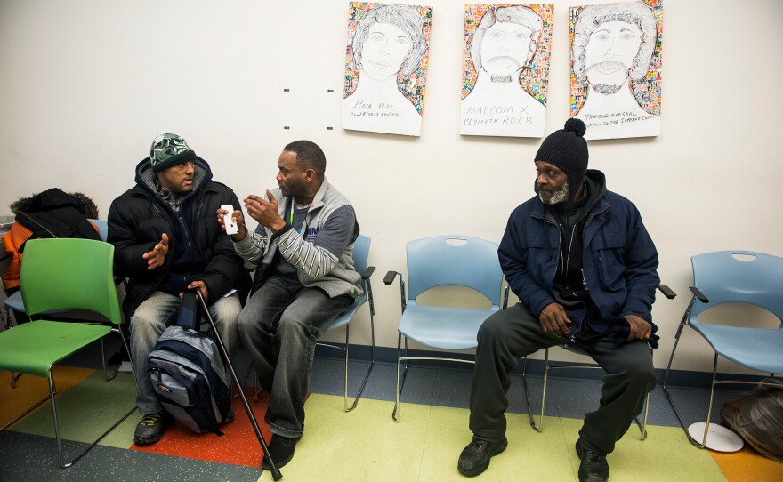 Tony Simmons (center) speaks with Amsted Hetherington during a group meeting about homeless issues at Health Care for the Homeless in Baltimore.
