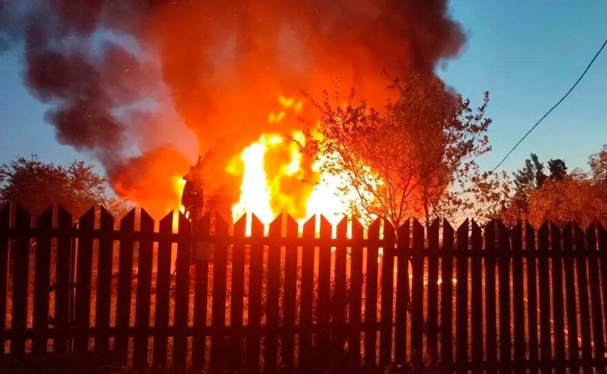 This photo released by Moscow Region Governor Andrei Vorobyev's official telegram channel shows a house on fire after a Ukrainian attack in Khimki, just outside Moscow, Russia, on Sunday, May 17, 2026.