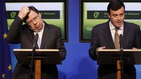 Irish Prime Minister Brian Cowen (left) and Finance Minister Brian Lenihan spoke to the media Sunday in Dublin after debt-stricken Ireland formally appealed for a massive bailout.