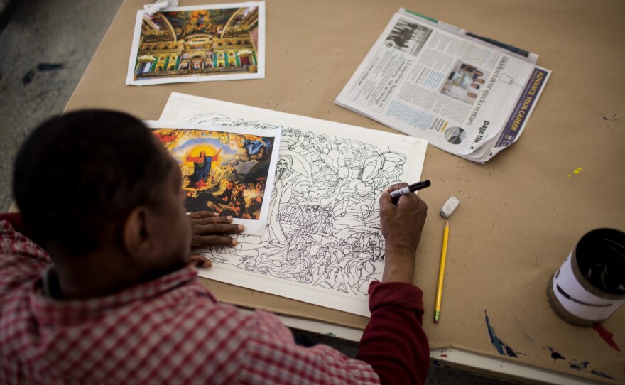 Inspired by an image of Jesus Christ's Last Judgment, artist Raymond Lewis creates a detailed ink drawing in the Art Enables studio.