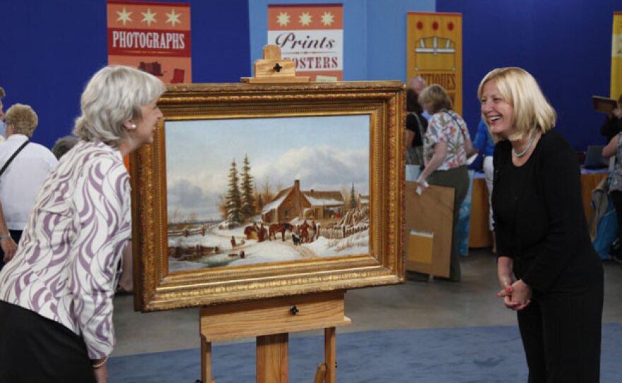 At ANTIQUES ROADSHOW in Atlantic City, this guest (right) brings in an heirloom oil painting by 19th-century Canadian artist Cornelius Krieghoff, known for painting vibrant scenes that tell a story. Appraiser Colleene Fesko is as pleased as the guest when she values the painting at an impressive $200,000 to $300,000.