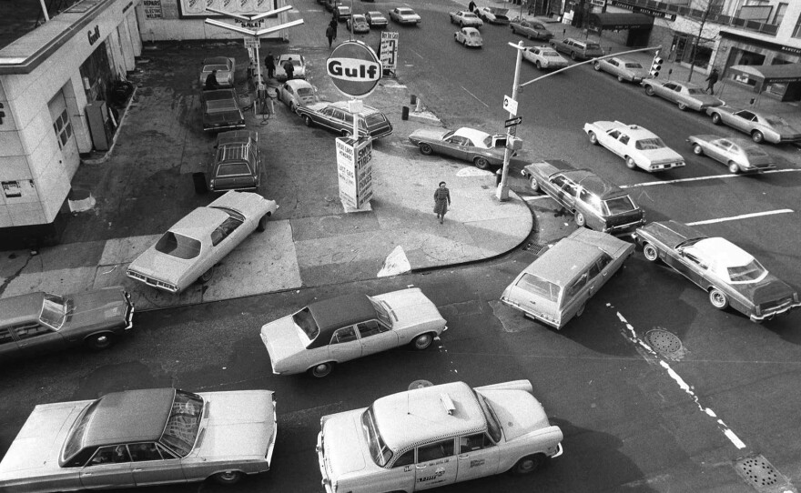 On Dec. 23, 1973, cars lined up in two directions at a gas station in New York City.