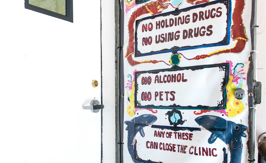 A painted sign outside the clinic's door reminds patients that illicit drugs aren't tolerated.