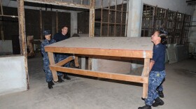 Sailors assigned to the amphibious assault ship USS Makin Island, assist with cleanup efforts in the laundry building at Alcatraz Island during a San Francisco Fleet Week 2012 community service project. 