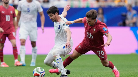 Portugal's Francisco Conceicao, right, vies for the ball with Uzbekistan's Khojiakbar Alijonov during the World Cup Group K soccer match between Portugal and Uzbekistan in Houston, June 23.