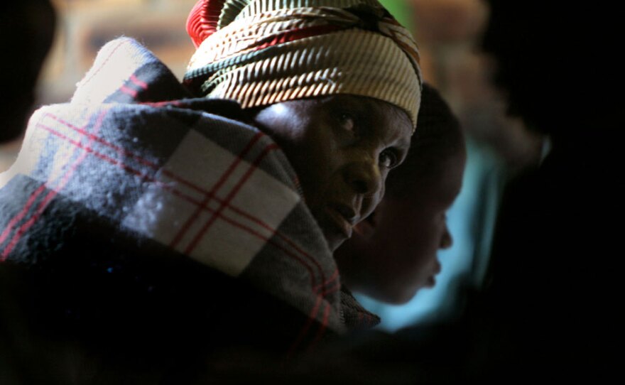 A woman waits in line for treatment at an AIDS clinic in Elandsdoorn, South Africa in 2006. In the last year treatment clinics such as this one have increased antiretroviral treatment greatly.