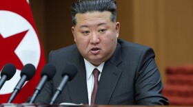 In this photo provided by the North Korean government, its leader Kim Jong Un delivers a speech during a session of the Supreme People's Assembly at parliament in Pyongyang, North Korea Monday, March 23, 2026.